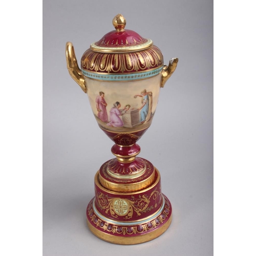 50 - A Vienna two-handled pot and cover with classical figure decoration on a crimson ground, 8 1/2