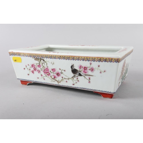 62 - A Chinese porcelain famille rose decorated rectangular planter, 9 1/2