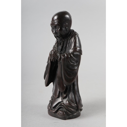 65 - A Chinese bronzed and filled figure of Laotzu, 4 3/4