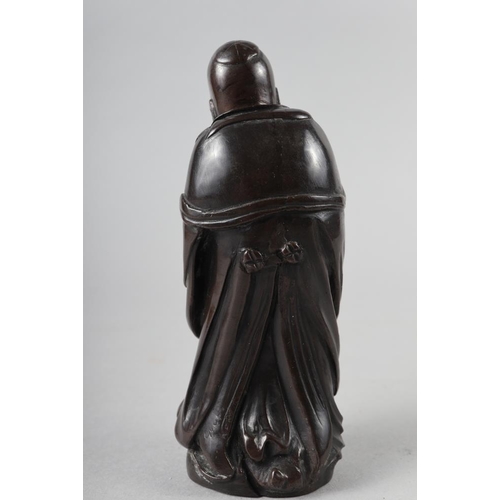 65 - A Chinese bronzed and filled figure of Laotzu, 4 3/4