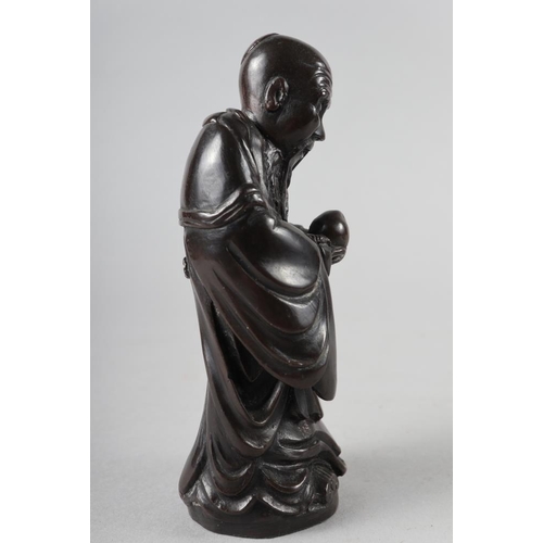 65 - A Chinese bronzed and filled figure of Laotzu, 4 3/4