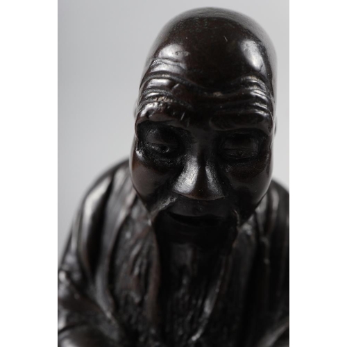 65 - A Chinese bronzed and filled figure of Laotzu, 4 3/4