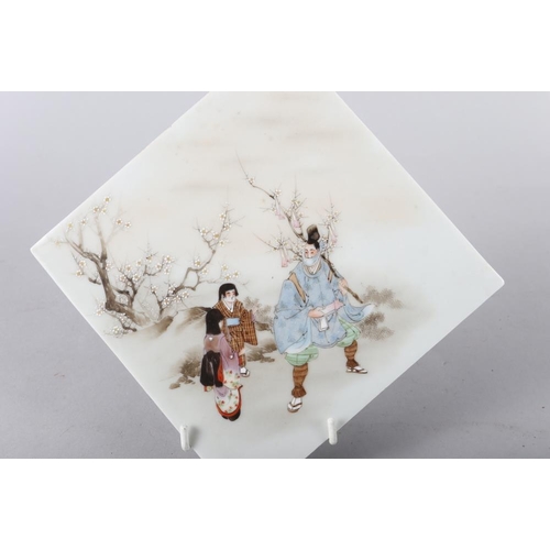 66 - A set of three Japanese hand-painted porcelain tiles with samurai figure decoration, largest 6 3/4