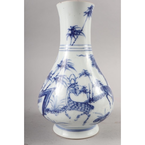 67 - A Chinese blue and white baluster vase, decorated fallow deer in a landscape, with six character mar... 