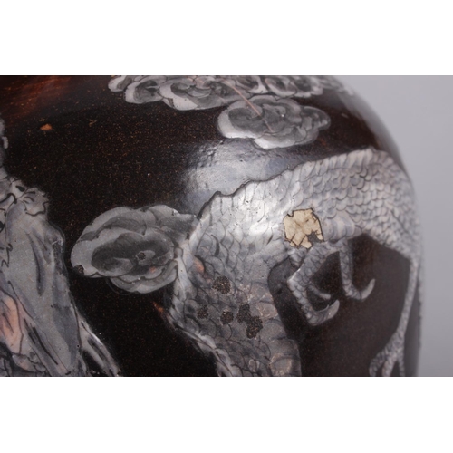 69 - An Oriental brown glazed ginger jar, decorated dragon, 7 1/4