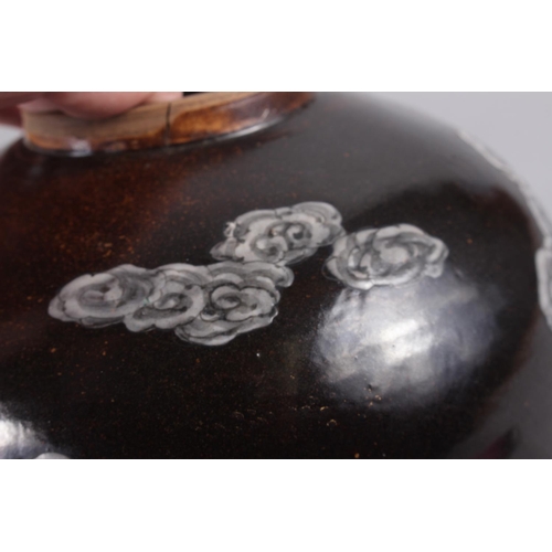 69 - An Oriental brown glazed ginger jar, decorated dragon, 7 1/4