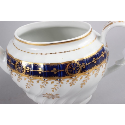 7 - An early 19th century teapot with blue and gilt decoration, 6 1/2