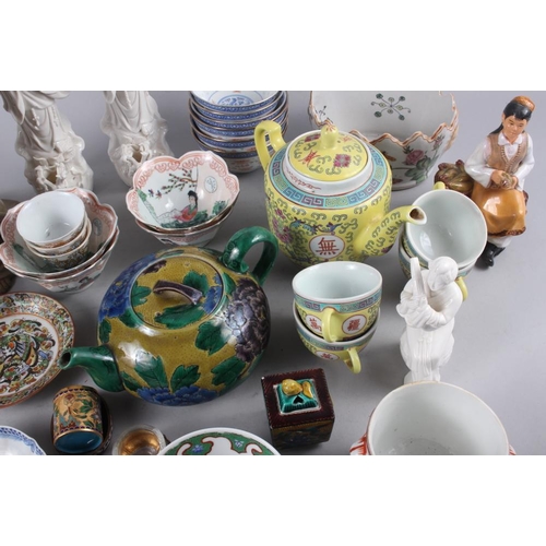 70 - A Chinese yellow polychrome decorated teapot and four matching teacups, a planter with insect and fl... 