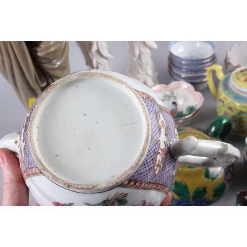 70 - A Chinese yellow polychrome decorated teapot and four matching teacups, a planter with insect and fl... 