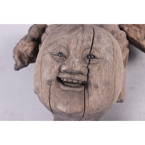 72 - A Japanese carved rootwood bust of a bearded elder, 11