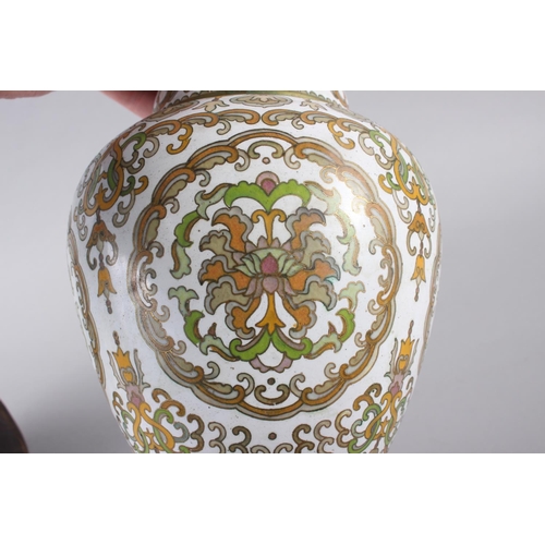 76 - A Chinese cloisonne two handled vase with floral and scrolled decoration, 10