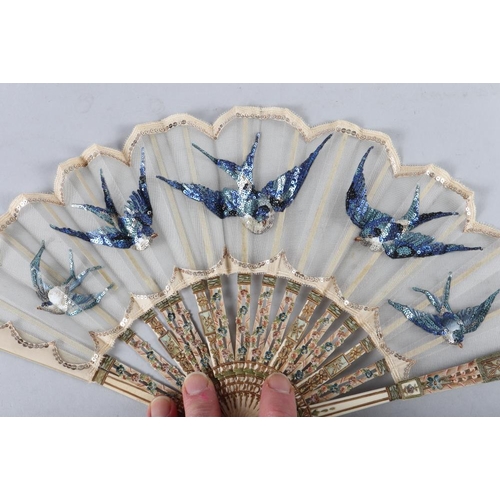 82 - A late 19th century ivory fan with bluebird sequinwork design, and five other fans