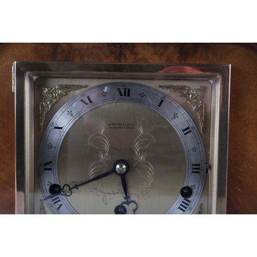 86 - An Elliott walnut cased mantel clock with gilt and silvered dial and Roman numerals, 9 1/4