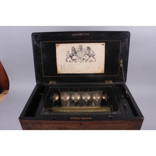 91 - A 19th century six-tune musical box with bells, in burr walnut and kingwood banded case, movement nu... 