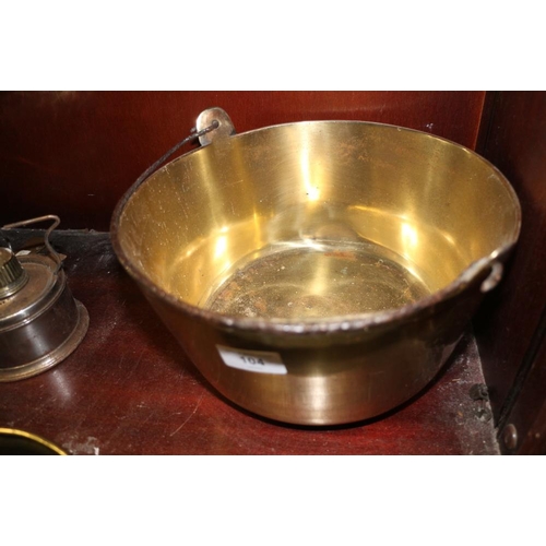 104 - A brass preserve pan with swing handle, a brass coal scuttle, a set of six brass curtain tie-back ho... 