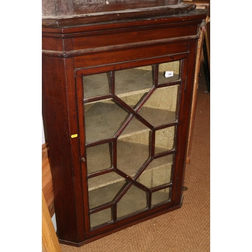 298 - A late Georgian mahogany corner hanging cupboard enclosed lattice glazed door, 31