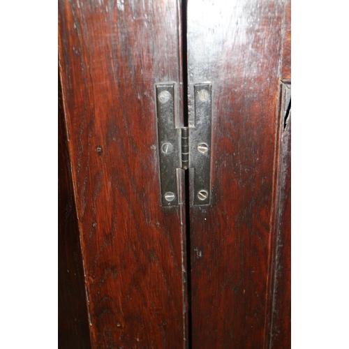 332 - A late Georgian oak corner hanging cupboard enclosed panel door with original green painted interior... 