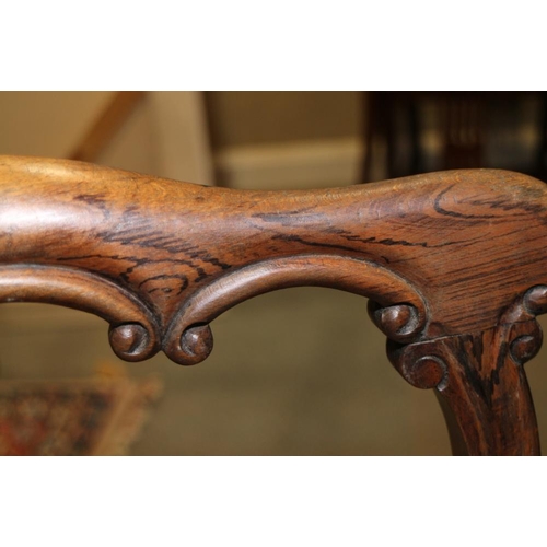 334 - A late Victorian grained as rosewood carved bar back side chair with caned panel seat