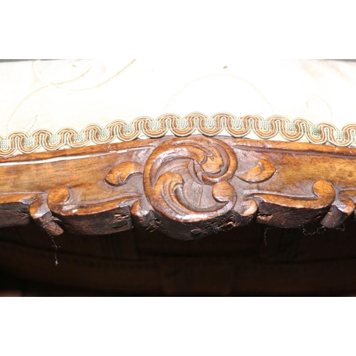 337 - A late 19th century carved walnut serpentine framed low stool, on cabriole supports, 15