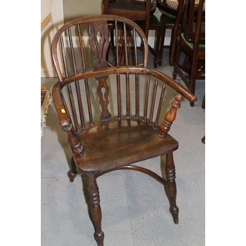 338 - An early 19th century ash and elm panel Windsor splat back elbow chair, on turned supports with crin... 