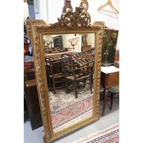 346 - A gilt framed wall mirror with pierced cresting, on moulded frame plate, 25 1/2