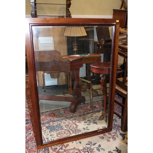 347 - A walnut framed wall mirror with bevelled edge plate, 27