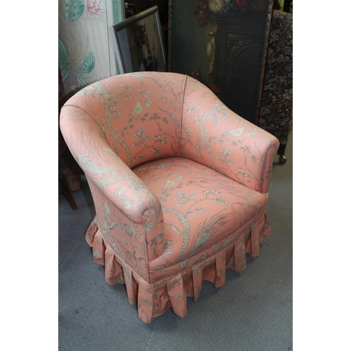 407 - An Edwardian polished as walnut tub-shape armchair, upholstered in a pink floral fabric, on square t... 