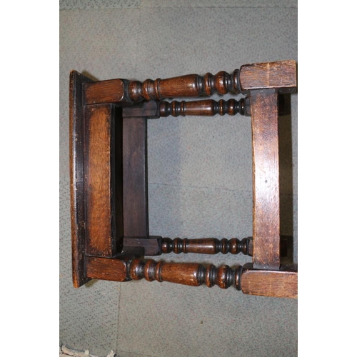 409 - An oak joint stool of 17th century design, on turned and stretchered supports, 17 3/4