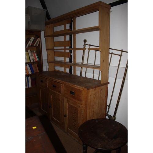 416 - A waxed pine dresser with open shelves over three drawers and three cupboards, on block base, 62