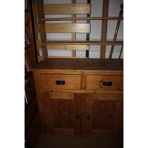 416 - A waxed pine dresser with open shelves over three drawers and three cupboards, on block base, 62