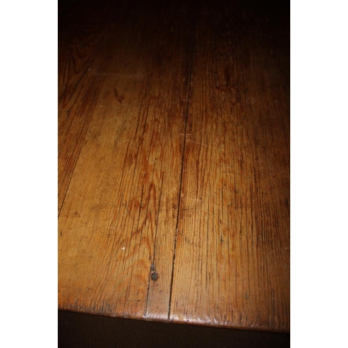 420 - A waxed pine kitchen table, on square taper supports, 71