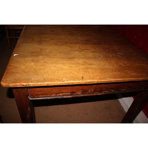 420 - A waxed pine kitchen table, on square taper supports, 71