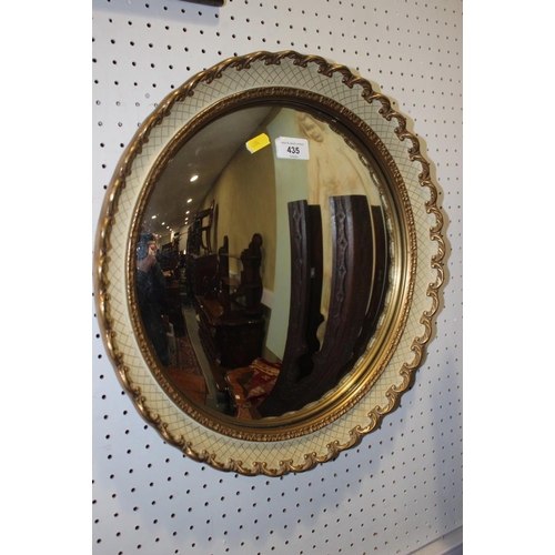 435 - A gilt framed convex wall mirror with cream cross-hatched decoration, plate 13