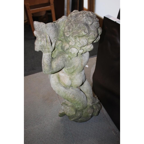 446 - A cast stone figure of putto with a leaf, 28