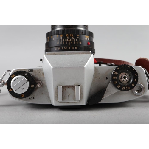 83 - A Leicaflex SL Leitz Wetzlar camera, Serial Number 1295519 and Summircron R 1:2/50 lens, in travelli... 