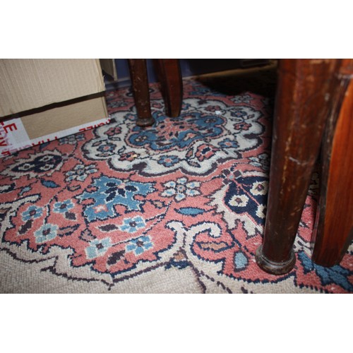 438 - A Persian design carpet with central floral medallion on a buff ground and multi-borders in shades o... 