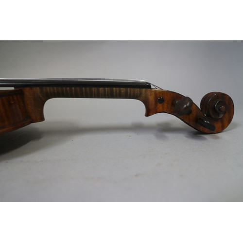 137 - A violin with two-piece back and a bow, 22 3/4