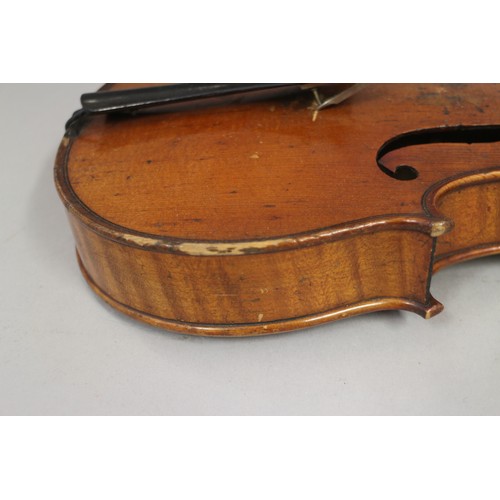 137 - A violin with two-piece back and a bow, 22 3/4