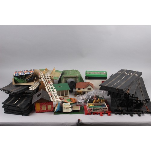 119 - A collection of early Scalextric track, accessories including Shell hut, Dunlop hut/shed, Scalextric... 