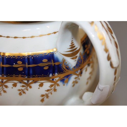 7 - An early 19th century teapot with blue and gilt decoration, 6 1/2