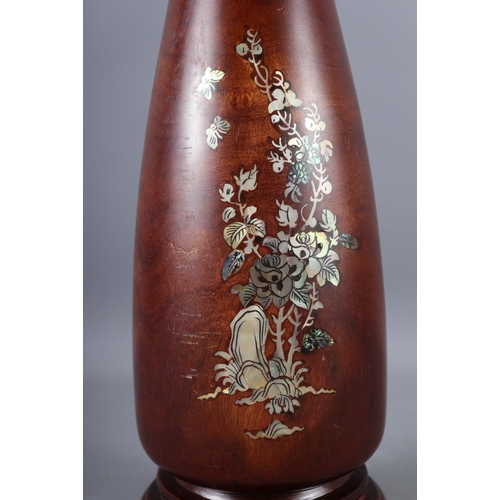 107 - A Japanese blue and white oval shaped vase, decorated trees and figures in a boat (hairline crack), ... 