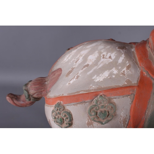 112 - A Tang style painted terracotta model of a horse, 20 1/4