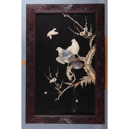 118 - A pair of Shibuyama panels, decorated birds and trees, in carved wooden frames, 23 1/4