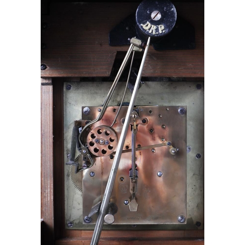 134 - An oak cased bracket clock with chiming movement, silvered dial and Roman numerals, 18 1/2