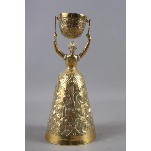 152 - A brass wager cup, 8 1/2