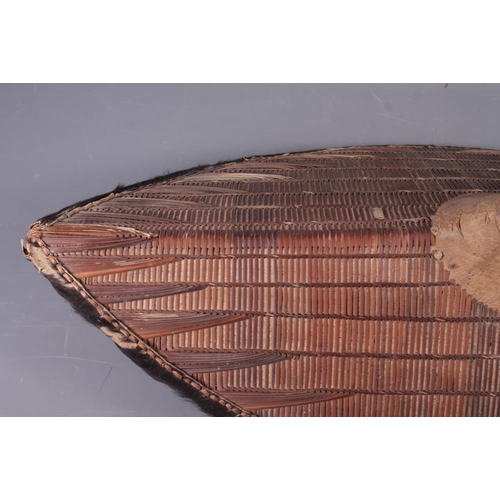 191 - Two Ganda shields with traditional woven rattan design and  fur borders, 30