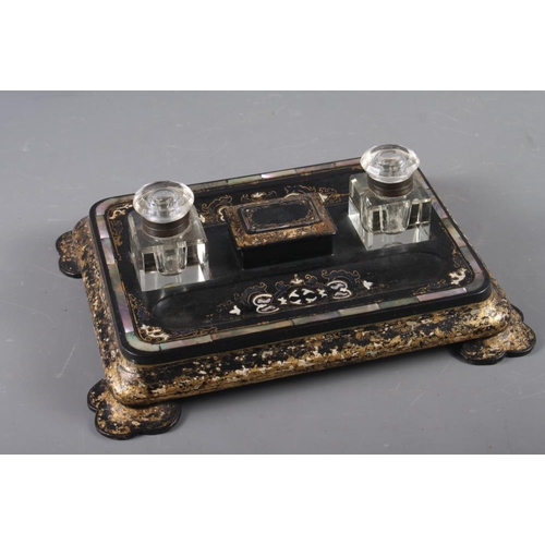 226 - A papier-mache inkstand with mother-of-pearl insets and gilt borders