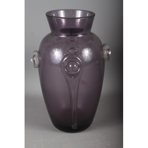 23 - An early 20th century amethyst glass vase with applied decoration, 10