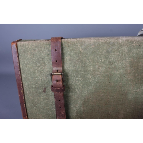 238 - A green canvas and leather bound gun case, initialled 