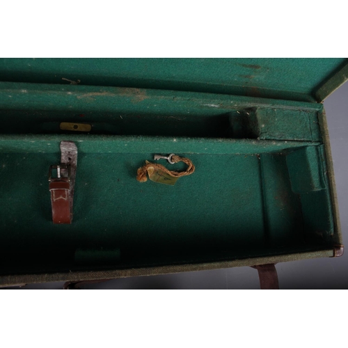 238 - A green canvas and leather bound gun case, initialled 